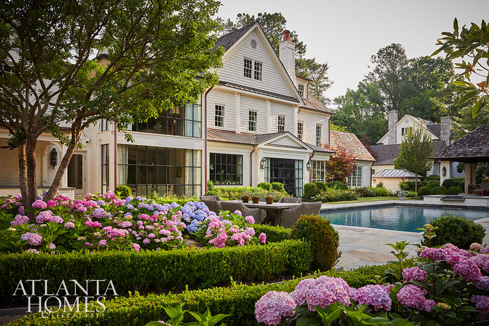 Source Atlanta Homes & Lifestyles | Interior Design by Andrea Henzlik Design  | Architect Greg Busch Architects | Photographed by Emily Followill | Styled by Eleanor Roper  | Landscape Architect Carson McElheney, Hamilton Land Services Inc | Builder Roger Balko - gorgeous pool and hydragea gardens - A beautiful traditional home inside and out