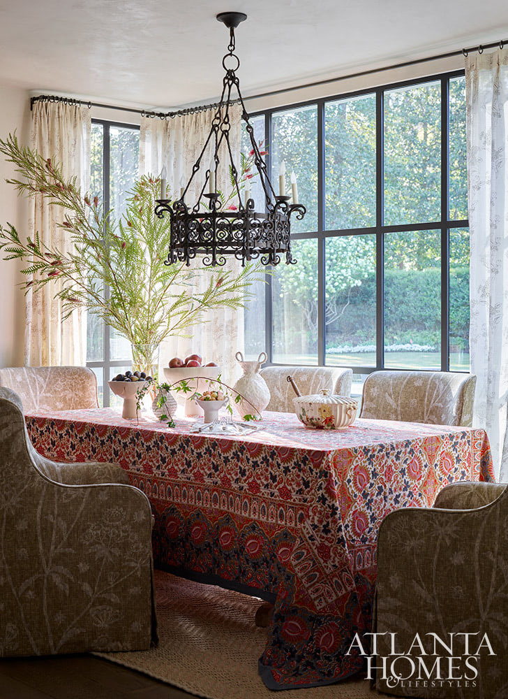A Beautiful Traditional Home Inside and Out - Source Atlanta Homes & Lifestyles | Interior Design by Andrea Henzlik Design  | Architect Greg Busch Architects | Photographed by Emily Followill | Styled by Eleanor Roper  | Landscape Architect Carson McElheney, Hamilton Land Services Inc | Builder Roger Balko - beautiful traditional home with table and chairs in the breakfast room overlooking the pool