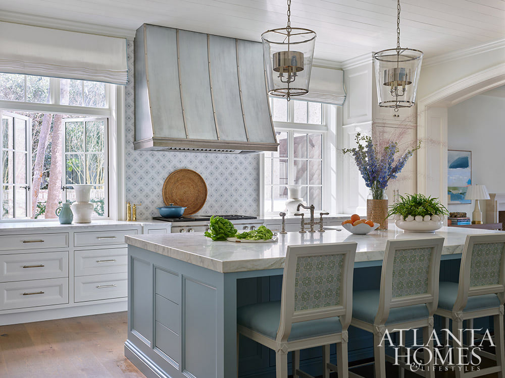 Heather Dewberry, one of our favorite designers,  Architect Josh Youngner,  Builder Matthew McHale, Ramsey McHale, and Landscape Architect Sea Island Landscape, and Stylist Jimmie Henslee in this months Atlanta Home & Lifestyle, make designing a coastal oasis look effortless, as evidenced by this gorgeous Sea Island Home. Beautiful blue and white kitchen with stainless range hood 