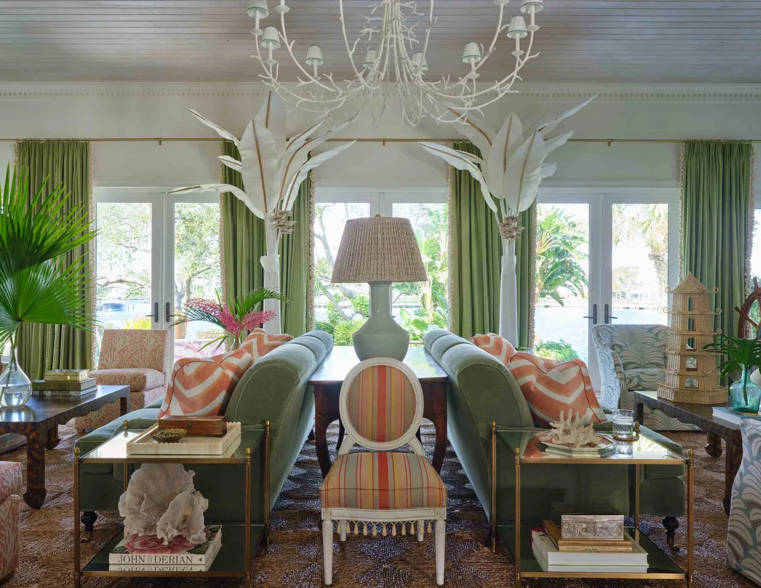 Tour a traditional coastal home with beautiful antiques, collected charm, and a relaxed seaside feel. You'll love every fabulous detail! Beautiful palm trees and Rush house rug in living room