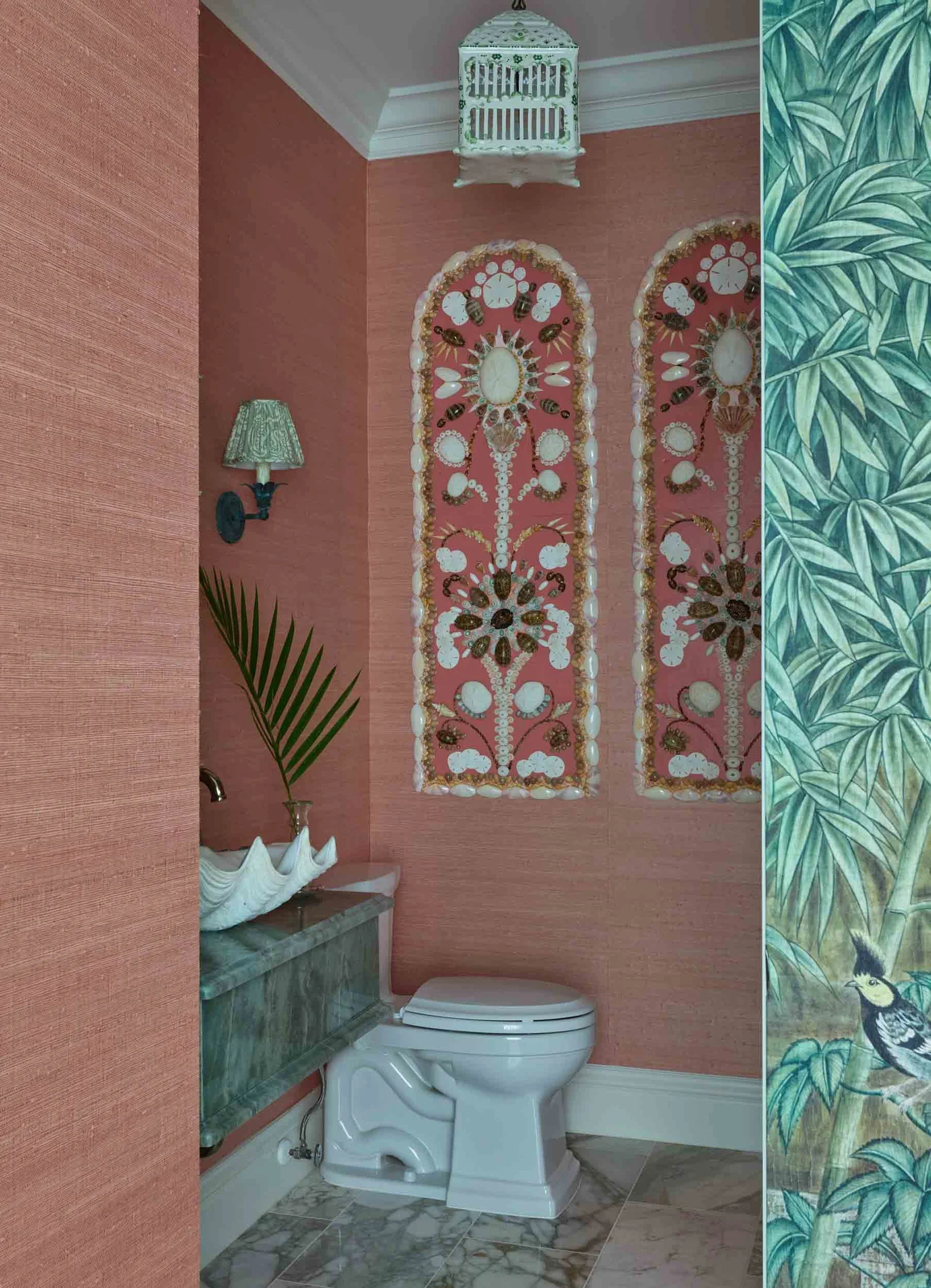 Beautiful rosse shrimp colored grasscloth in bathroom with  handmade shell art