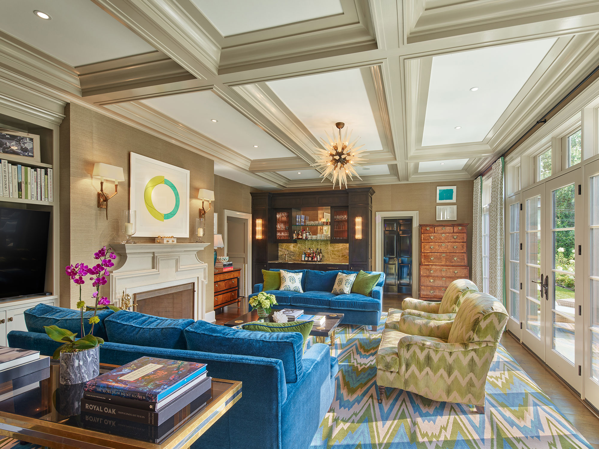 Archer & Buchanan Architects | Halkin | Mason Photography -We’d say this beautiful, traditional home, designed by Archer & Buchanan hits all the high notes of style. That is as livable and updated as it is fresh and character-filled. Vibrant family room with coffered ceilings and flame stitch rug