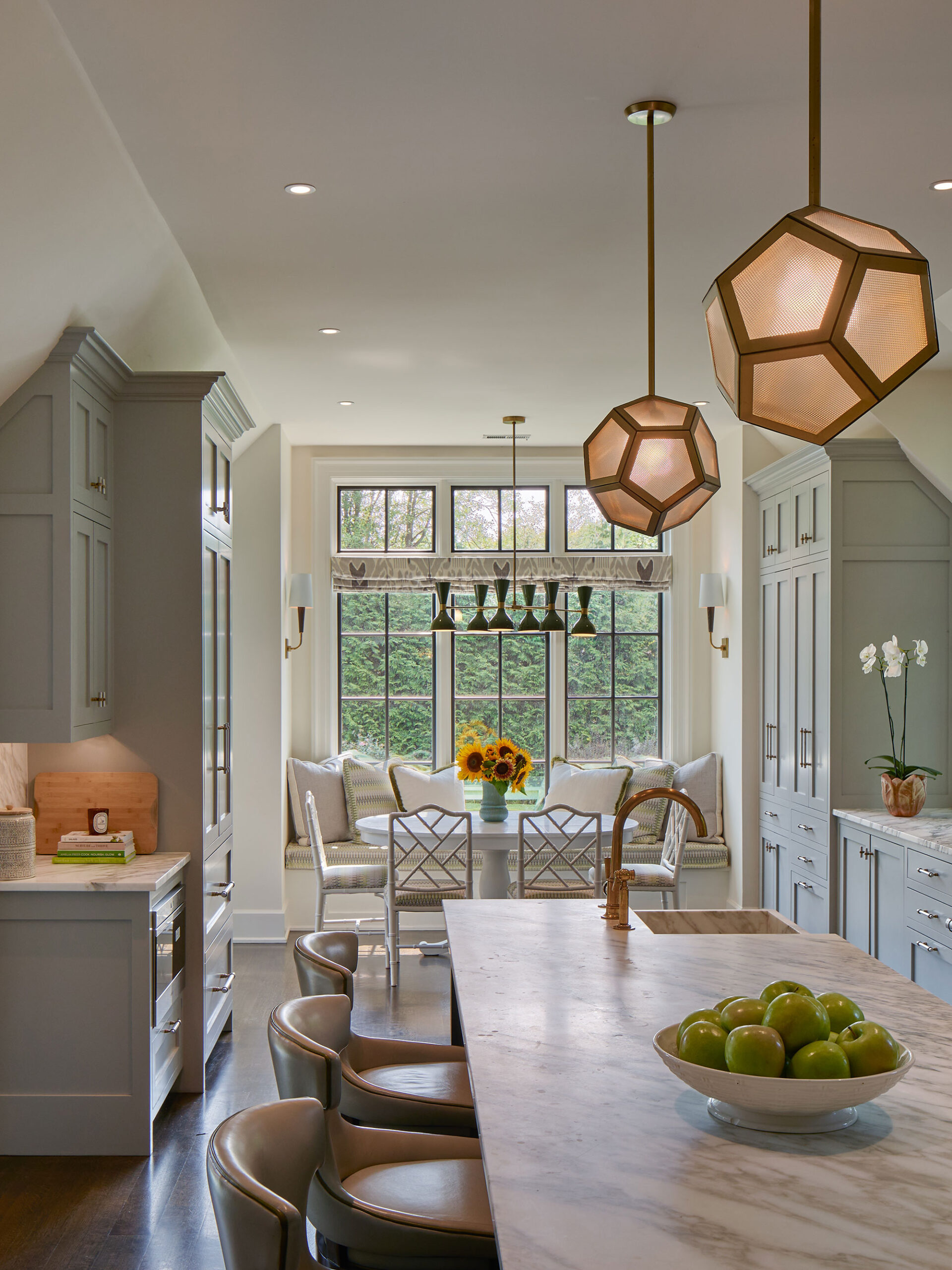 Archer & Buchanan Architects | Halkin | Mason Photography -We’d say this beautiful, traditional home, designed by Archer & Buchanan hits all the high notes of style. That is as livable and updated as it is fresh and character-filled.  Kitchen with gray cabinets and dining are with banquette seating and round table