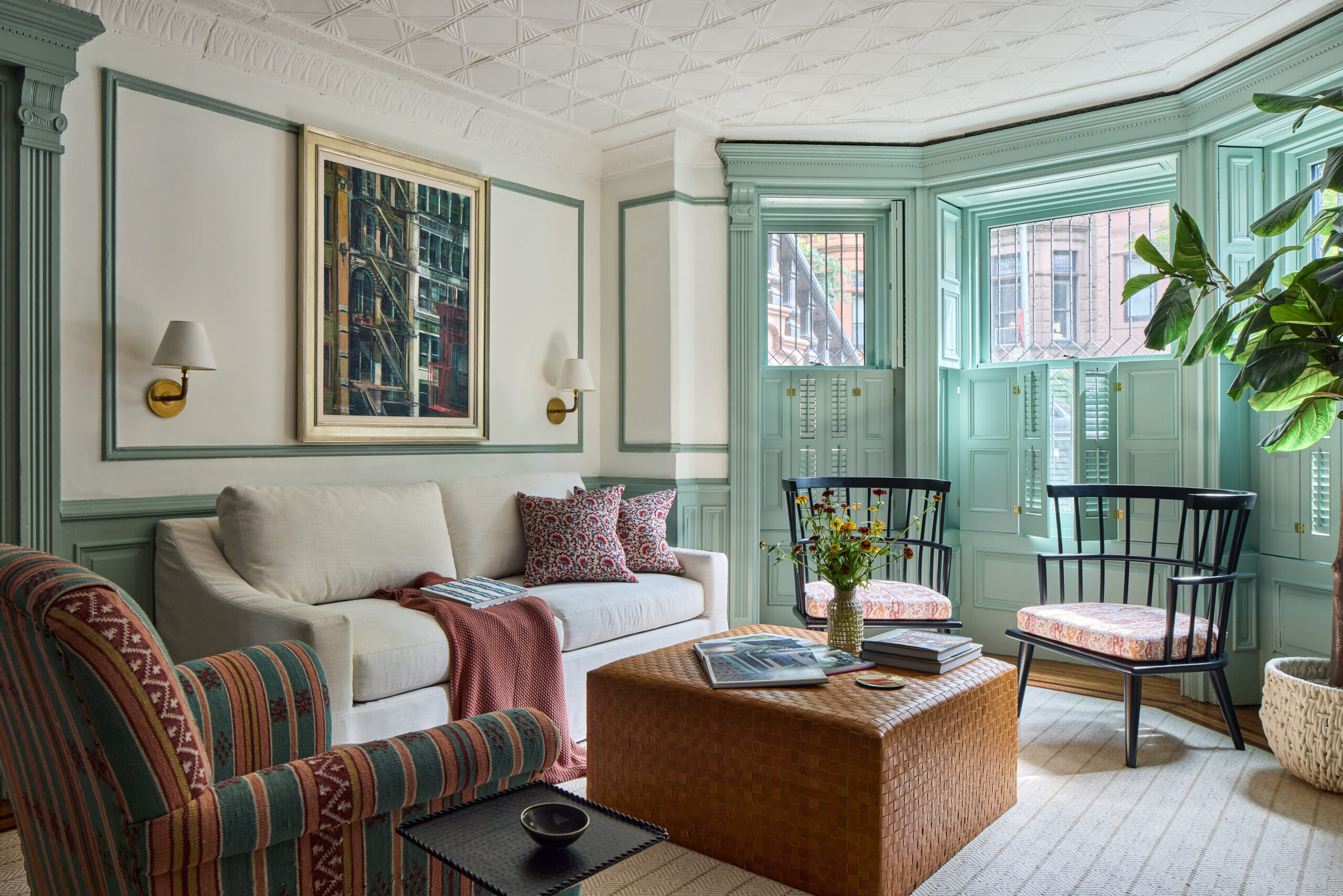 beautiful living room with white sofa and black windsor chairs with green molding - Jennifer Hunter Design | Kristen Francis Photography | Frances Bailey Styling
