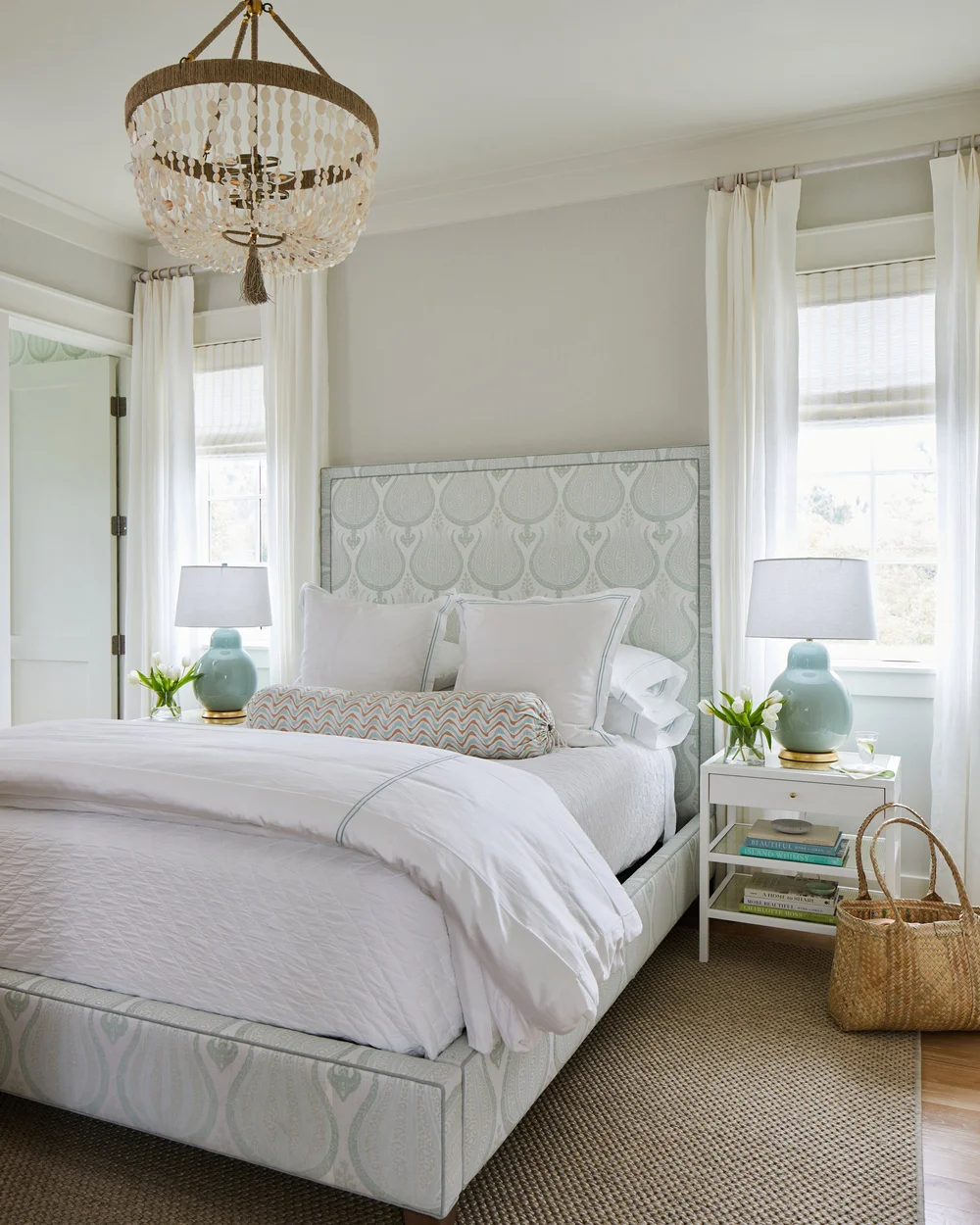 Sometimes a blue and white palette can feel predictable, but in this utterly charming Kara Miller-designed beach house, photographed by , Laurey W. Glenn and styled by Lindsey Ellis Beatty, it feels fresh and inviting. The various color tones, natural materials, and textured accents ground each space, creating a livable home with plenty of style. Blue and white beach house bedroom