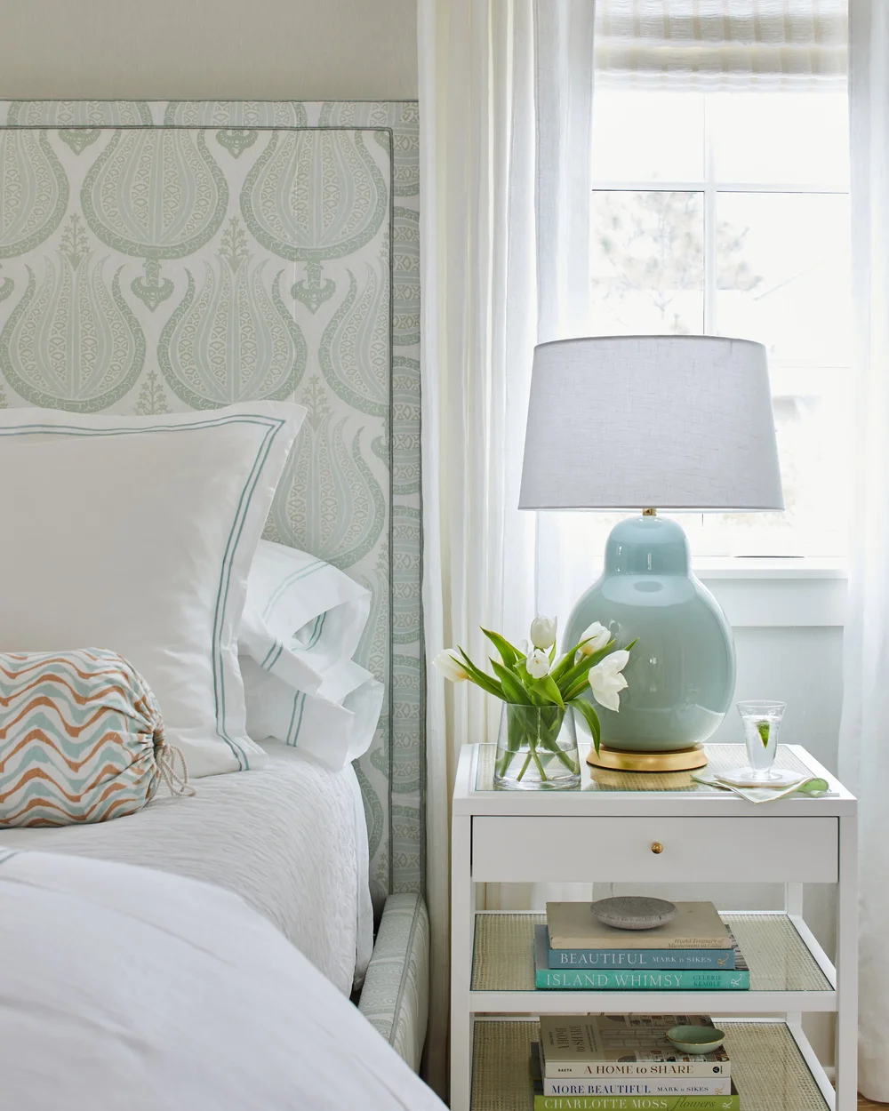 Sometimes a blue and white palette can feel predictable, but in this utterly charming Kara Miller-designed beach house, photographed by , Laurey W. Glenn and styled by Lindsey Ellis Beatty, it feels fresh and inviting. The various color tones, natural materials, and textured accents ground each space, creating a livable home with plenty of style.