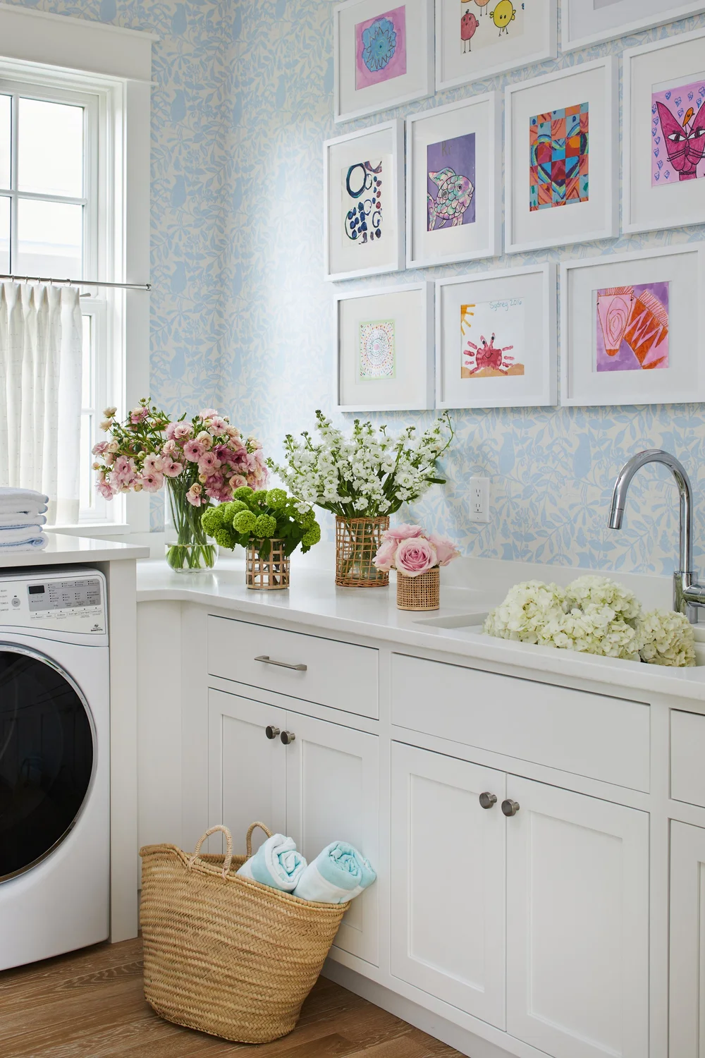 Utterly charming Kara Miller-designed beach house, photographed by , Laurey W. Glenn and styled by Lindsey Ellis Beatty, feels fresh and inviting. The various color tones, natural materials, and textured accents ground each space, creating a livable home with plenty of style. - charming wallpaper in the laundry room 