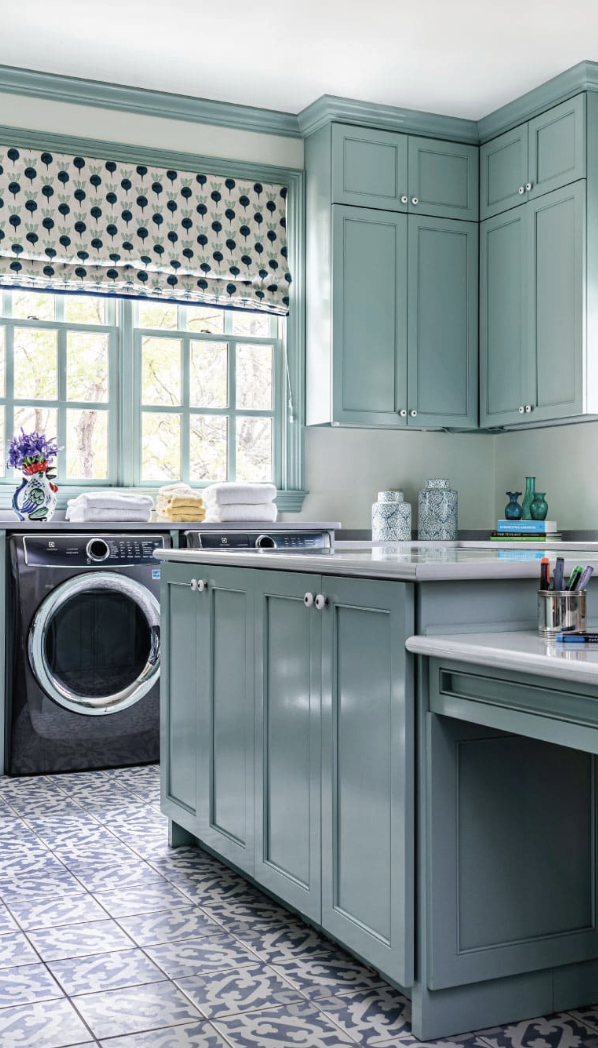 Home designed byAlexa Stevenson Interiors, with photography by Jeff Herr, is the perfect mix of traditional touches and updated details, well-suited for family, entertaining and more. Love the blue laundry room with charming fabric