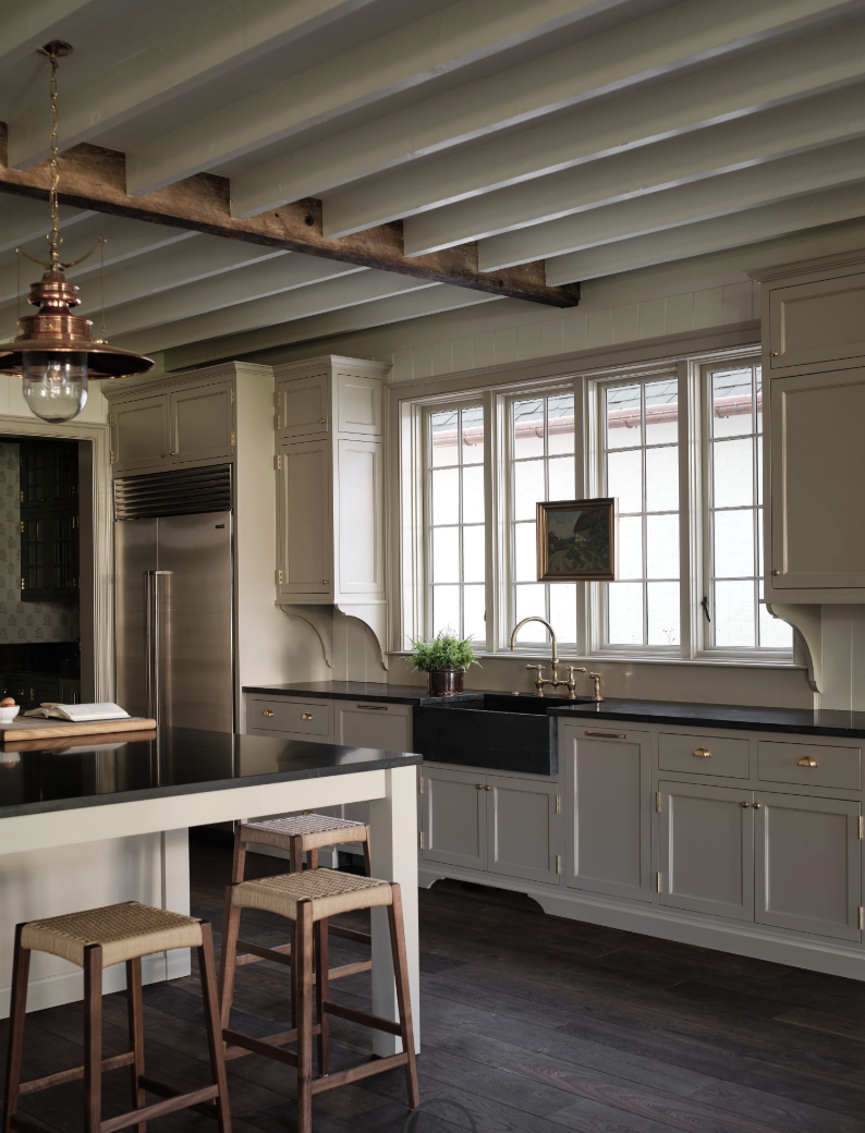 Check out this gorgeous home designed by one of our favorites, Sabbe Interior Design, with beautiful photography by Joseph Bradshaw. Charming kitchen with wood beams, farmhouse sink and soapstone countertops
