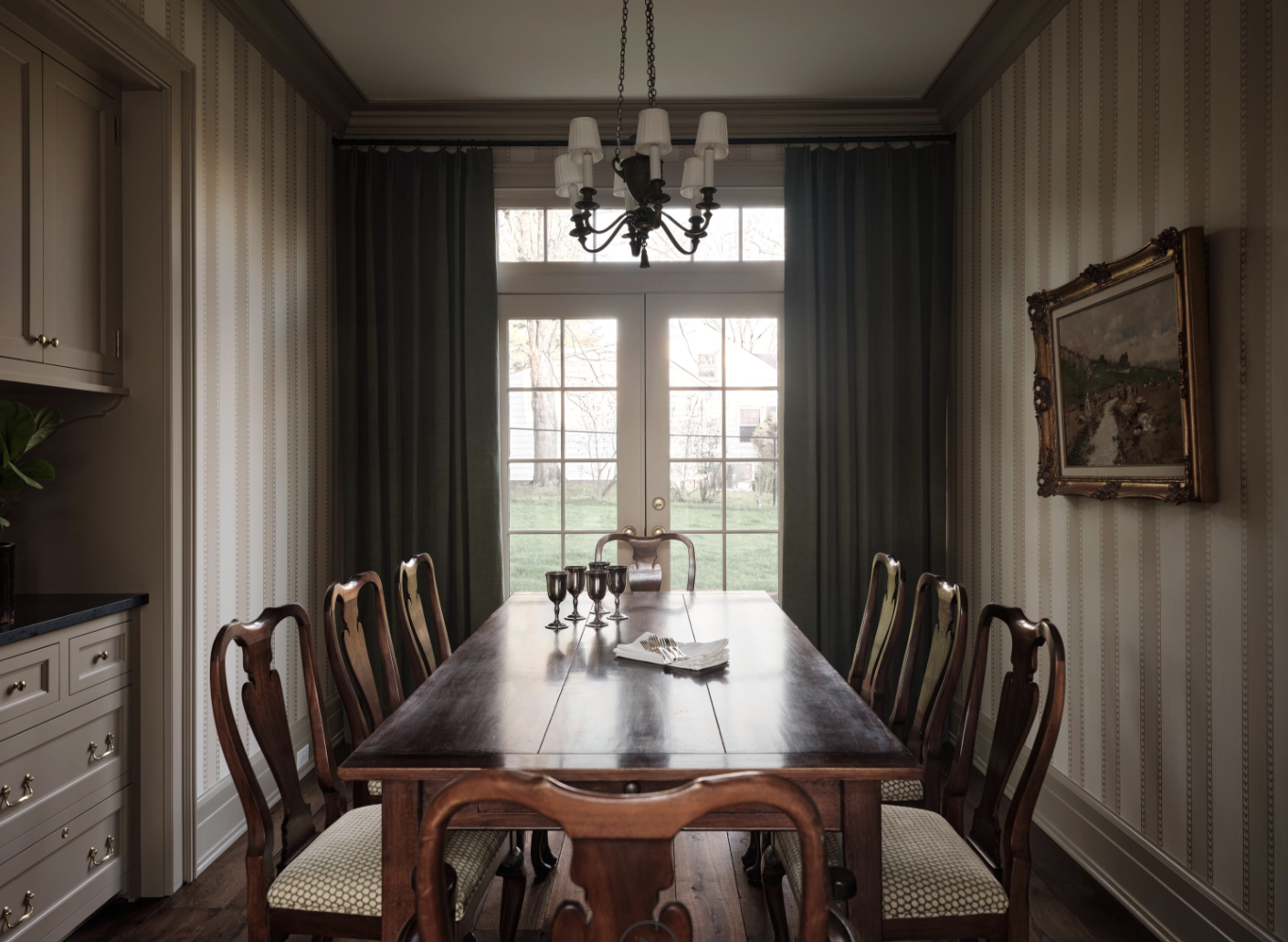 Check out this gorgeous home designed by one of our favorites, Sabbe Interior Design. with beautiful photography by Joseph Bradshaw.  Dining room with long rectangular table and stripe wallpaper