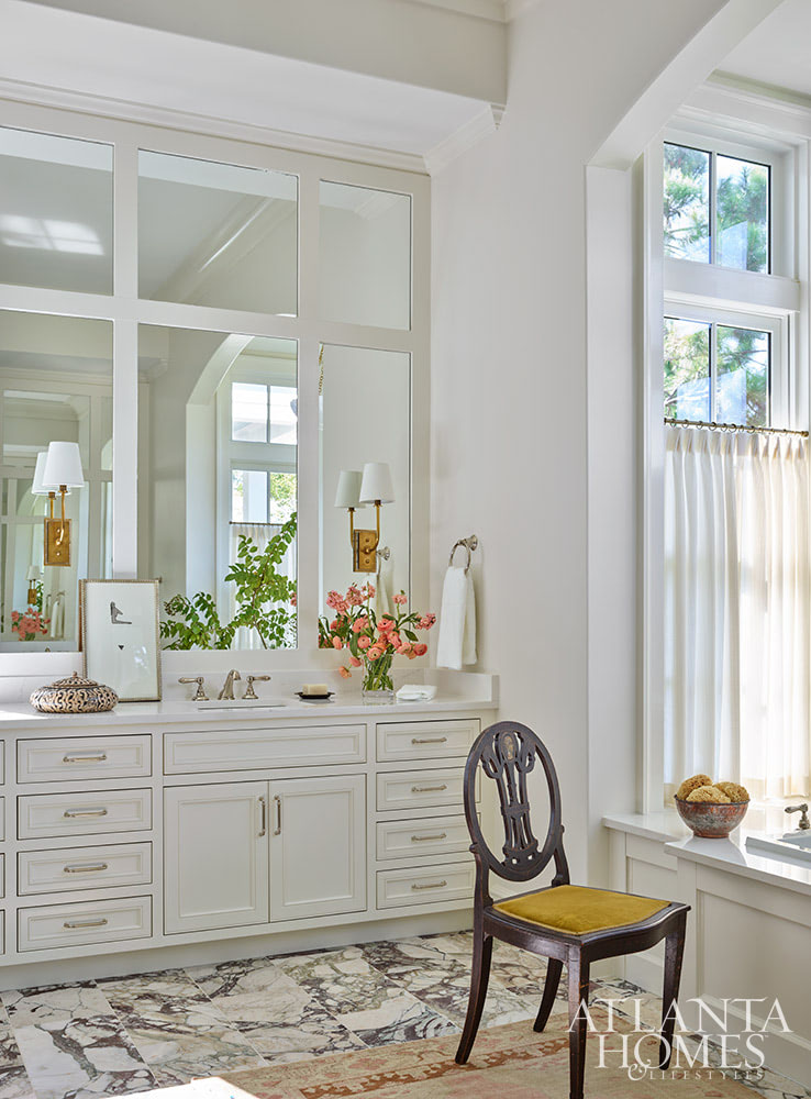 INTERIOR DESIGN: Kim Scodro Interiors| ARCHITECT: William Court, Court Atkins Group | BUILDER: Brett Flanagan, Flanagan Development | LANDSCAPE ARCHITECT: Troy Anderson, Spartina Studio | CABINETRY DESIGN: Jamestown Designer Kitchens | PHOTOGRAPHY: Emily Followill Photography | STYLIST: Eleanor RoperBeautiful bedroom with white cabinets and built in bathtub