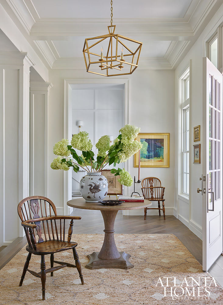 INTERIOR DESIGN: Kim Scodro Interiors| ARCHITECT: William Court, Court Atkins Group | BUILDER: Brett Flanagan, Flanagan Development | LANDSCAPE ARCHITECT: Troy Anderson, Spartina Studio | CABINETRY DESIGN: Jamestown Designer Kitchens | PHOTOGRAPHY: Emily Followill Photography | STYLIST: Eleanor RoperWith the days getting longer and the warmer, it's the perfect time to take a trip to a gorgeous St. Simons Island home . Lush surroundings and even lusher interiors make this the ideal getaway. Round entry table