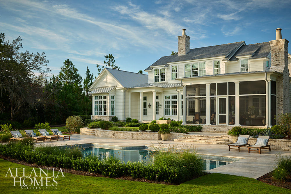 INTERIOR DESIGN: Kim Scodro Interiors| ARCHITECT: William Court, Court Atkins Group | BUILDER: Brett Flanagan, Flanagan Development | LANDSCAPE ARCHITECT: Troy Anderson, Spartina Studio | CABINETRY DESIGN: Jamestown Designer Kitchens | PHOTOGRAPHY: Emily Followill Photography | STYLIST: Eleanor Ropergreat backyard pool and pool area with chaise lounge chairs all around pool