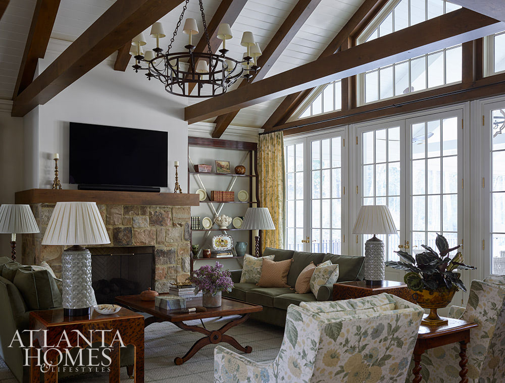 You’re going to love today’s post on the one-of-a-kind home designed by Nancy Izlar.  Known for her livable yet elegant aesthetic, Izlar seamlessly marries the best of both family heirlooms and traditional design elements for a collected style. Every corner of this perfectly styled home in Buckhead has been thoughtfully designed to maximize the breathtaking natural surroundings. With the large windows that let in plenty of natural light, this home combines beauty and comfort. Take a look at this timeless house tour, and we think you'll agree! Source: Atlanta Homes & Lifestyles | Interior Design: Nancy Izlar Interiors | Architect: Caroline Rolader, REU Architects | Builder: Wright Marshall and Greg DeLoach, Revival Construction | Landscape Architect: Land Plus | Photographed by Emily Followill | Styled by Holly Bryan and Erin Haraway - beautiful beams in living room
