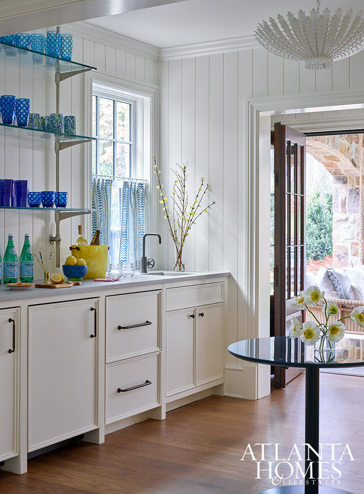 Source: Atlanta Homes & Lifestyles | Interior Design: Nancy Izlar Interiors | Architect: Caroline Rolader, REU Architects | Builder: Wright Marshall and Greg DeLoach, Revival Construction | Landscape Architect: Land Plus | Photographed by Emily Followill | Styled by Holly Bryan and Erin Haraway - love the white paneled walls in the kitchen with blue glasses
