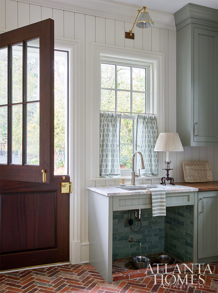 Source: Atlanta Homes & Lifestyles | Interior Design: Nancy Izlar Interiors | Architect: Caroline Rolader, REU Architects | Builder: Wright Marshall and Greg DeLoach, Revival Construction | Landscape Architect: Land Plus | Photographed by Emily Followill | Styled by Holly Bryan and Erin Haraway - charming mudroom with a great pet area