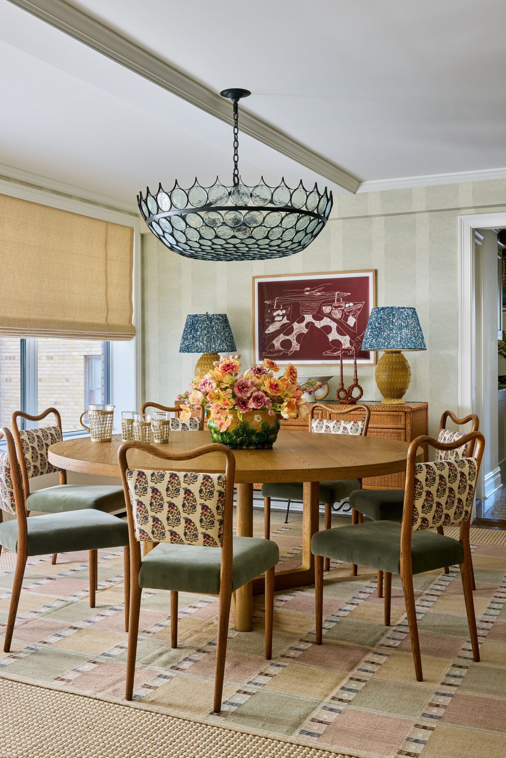 We hope your Wednesday is off to a terrific start. To get it off on the right note, we can't think of anything quite as nice as stepping inside this stunning house designed by Jennifer Hunter, photographed by Kirsten R. Francis, and styled by Martin R. Bourne. Round dining table in dining room with wallpaper and bamboo shades