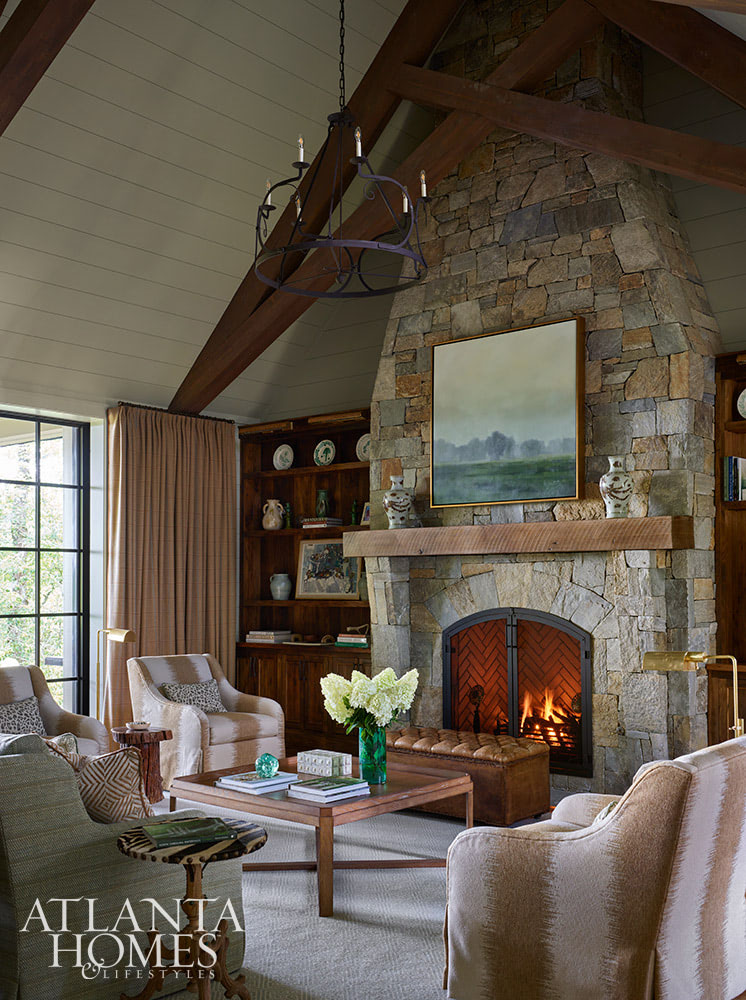 Source: Atlanta Homes & Lifestyles | Interior Design: Carolyn Kendall of Alcott Interiors | Shannon Hargrove of Logan Custom Homes | Emily Followill Photography- stone fireplace in living room with wood mantel