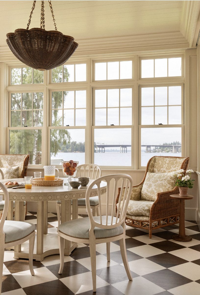 one-of-a-kind place in Lake Washington, designed by the talented Marianne Simon Interior Design, beautifully photographed by Aimee Mazzenga, and styled by Cate Ragan Stylist. - round dining table with a wicker chandelier over the table