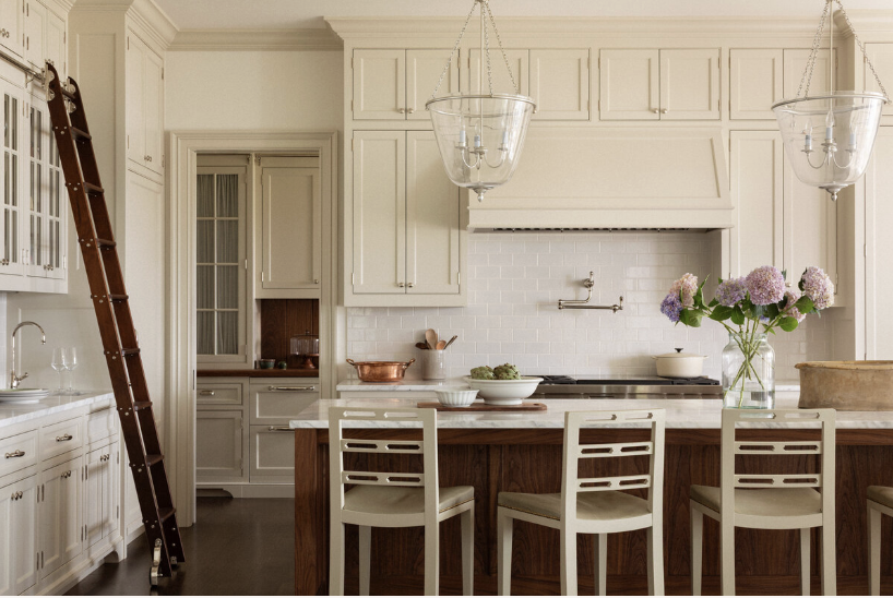 We hope you are having a great weekâand are in the mood for a timeless home tour, a one-of-a-kind place in Lake Washington, designed by the talented Marianne Simon Interior Design, beautifully photographed by Aimee Mazzenga, and styled by Cate Ragan Stylist. - kitchen with bell jar lamps over the island