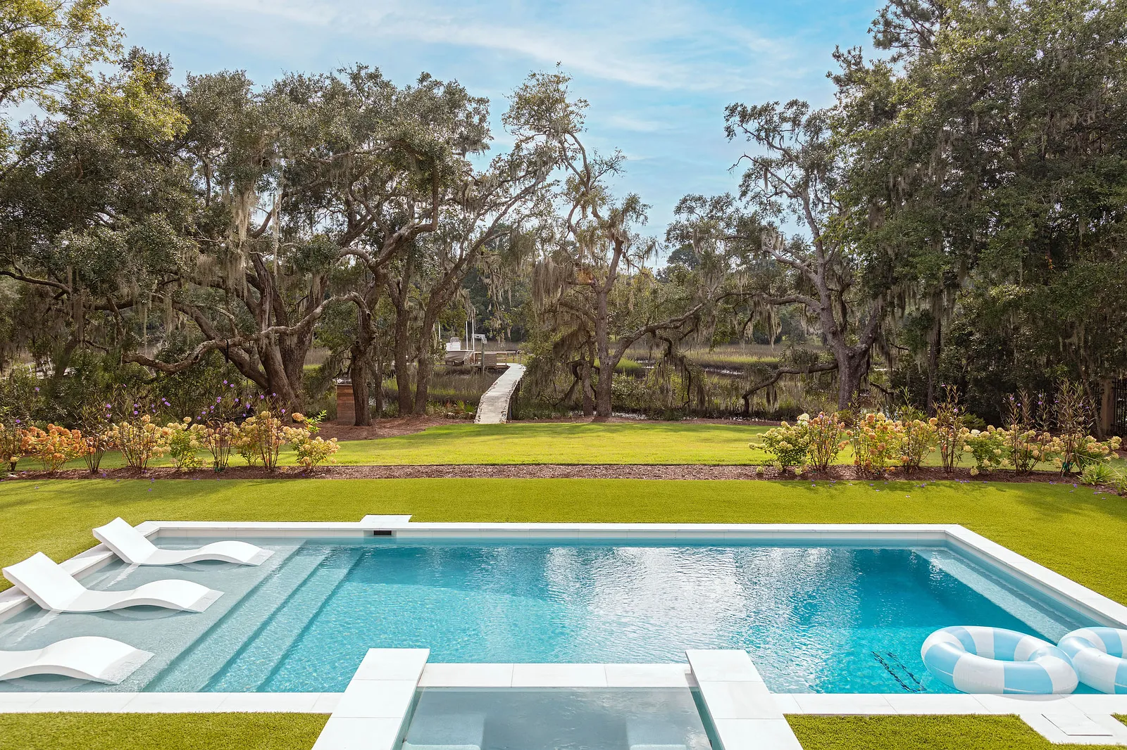 With summer officially here and beach season in full swing, we thought it made sense to see a beach house today--as if we need an excuse! This home designed by the talented Grace Frederick and photographed by Julia Lynn is the perfect mix of updated beauty and that classic, but fun, beach cottage chic that makes this the kind of place we would want to come back to again and again. Take the tour, and we think you'll agree! Obsessed with the Mario Torres chandelier in the living room
