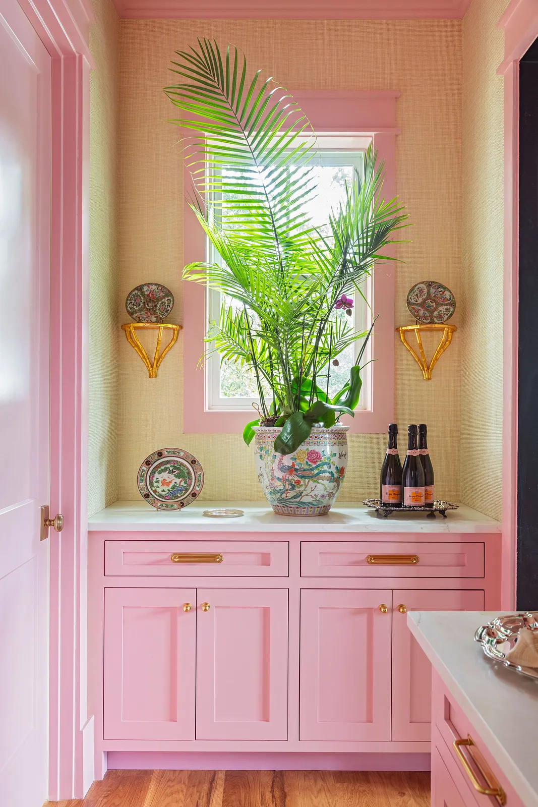 With summer officially here and beach season in full swing, we thought it made sense to go on an amazing coastal home tour  today--as if we need an excuse! This home designed by the talented Grace Frederick and photographed by Julia Lynn is the perfect mix of updated beauty and that classic, but fun, beach cottage chic that makes this the kind of place we would want to come back to again and again. Take the tour, and we think you'll agree! Obsessed with the Mario Torres chandelier in the living room
