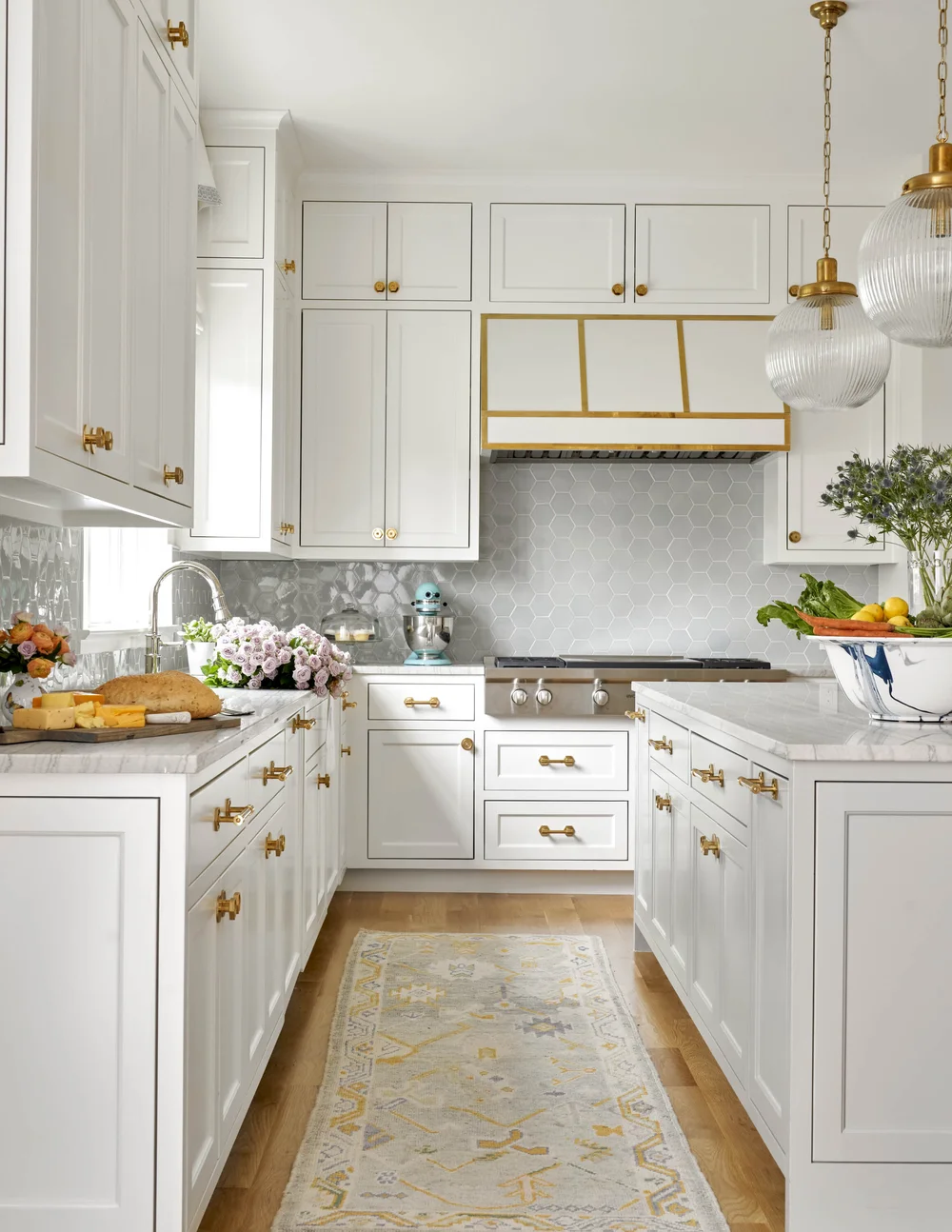 Mary Beth Wagner Interiors | Nathan Schroder Photography - beautiful white kitchen with brass accents and lovely oriental rugs