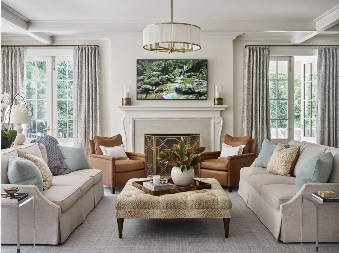 Interior Designer: Jessica Bradley Interiors | Architect: Frank Neely | Builder: Davey Construction | Photographer: Emily Followill | lassic home design ideas for a beautiful living room with abstract art and a pari of sofas.