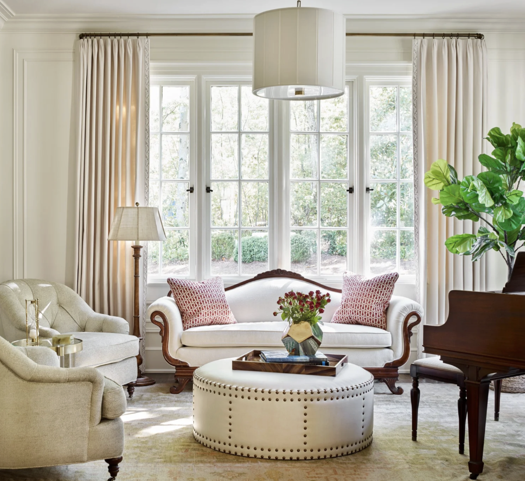Interior Designer: Jessica Bradley Interiors | Architect: Frank Neely | Builder: Davey Construction | Photographer: Emily Followill | Classic home design ideas for a beautiful living room with white sofa, chairs and ottoman - Love the addition of the grand piano