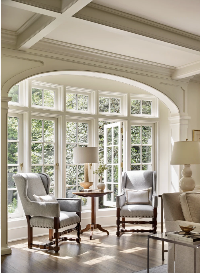 Interior Designer: Jessica Bradley Interiors | Architect: Frank Neely | Builder: Davey Construction | Photographer: Emily Followill | lassic home design ideas for a beautiful foyer. love the archway in the window of walls in the living room with a pair of wingback chairs
