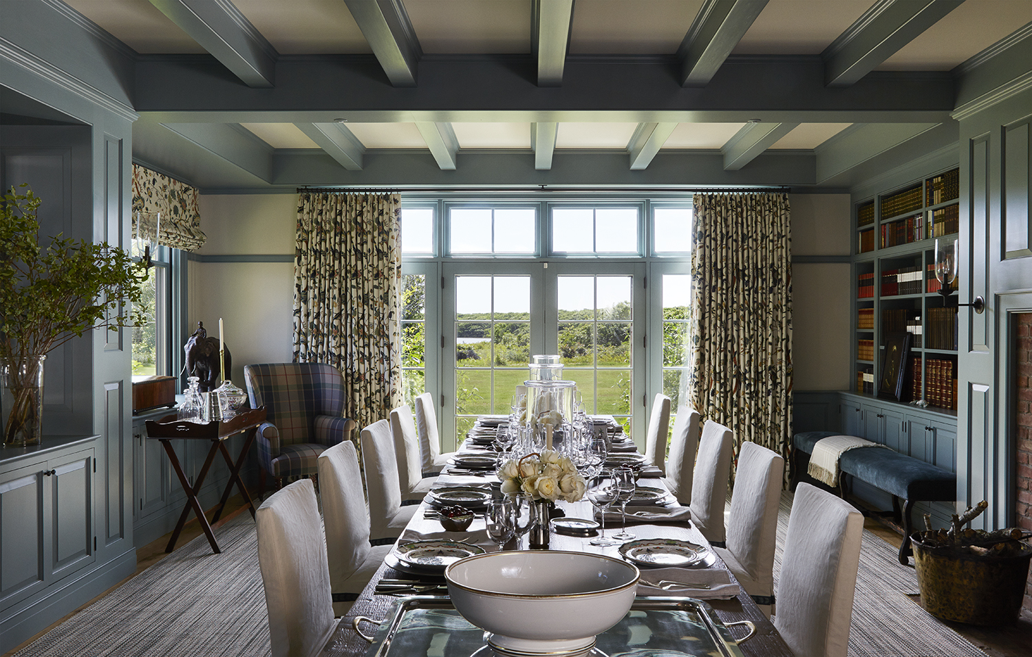 Beautiful, classic dining room with wood beams, traditional furniture, and beautiful architectural details