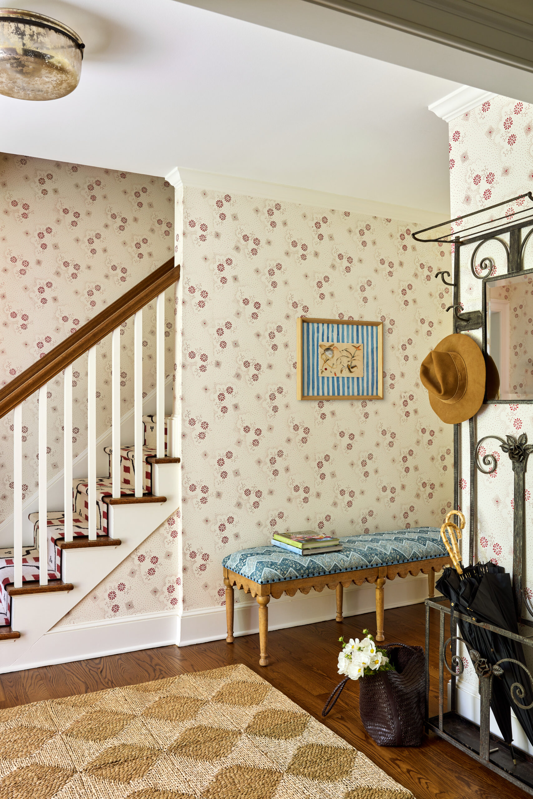 Jennifer Hunter creates perfect spaces in this timeless Bedford home and has us teeming with inspiration. Love the wallpaper in this foyer with a hall tree and charming bench
