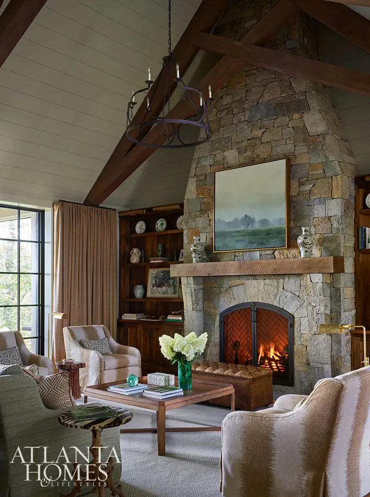 In the spirit of that, this fabulous mountain retreat is the perfect place to spend a summer day–and a great place to curl up by the fire come fall. Stone fireplace with rustic mantel and cathedral ceiling