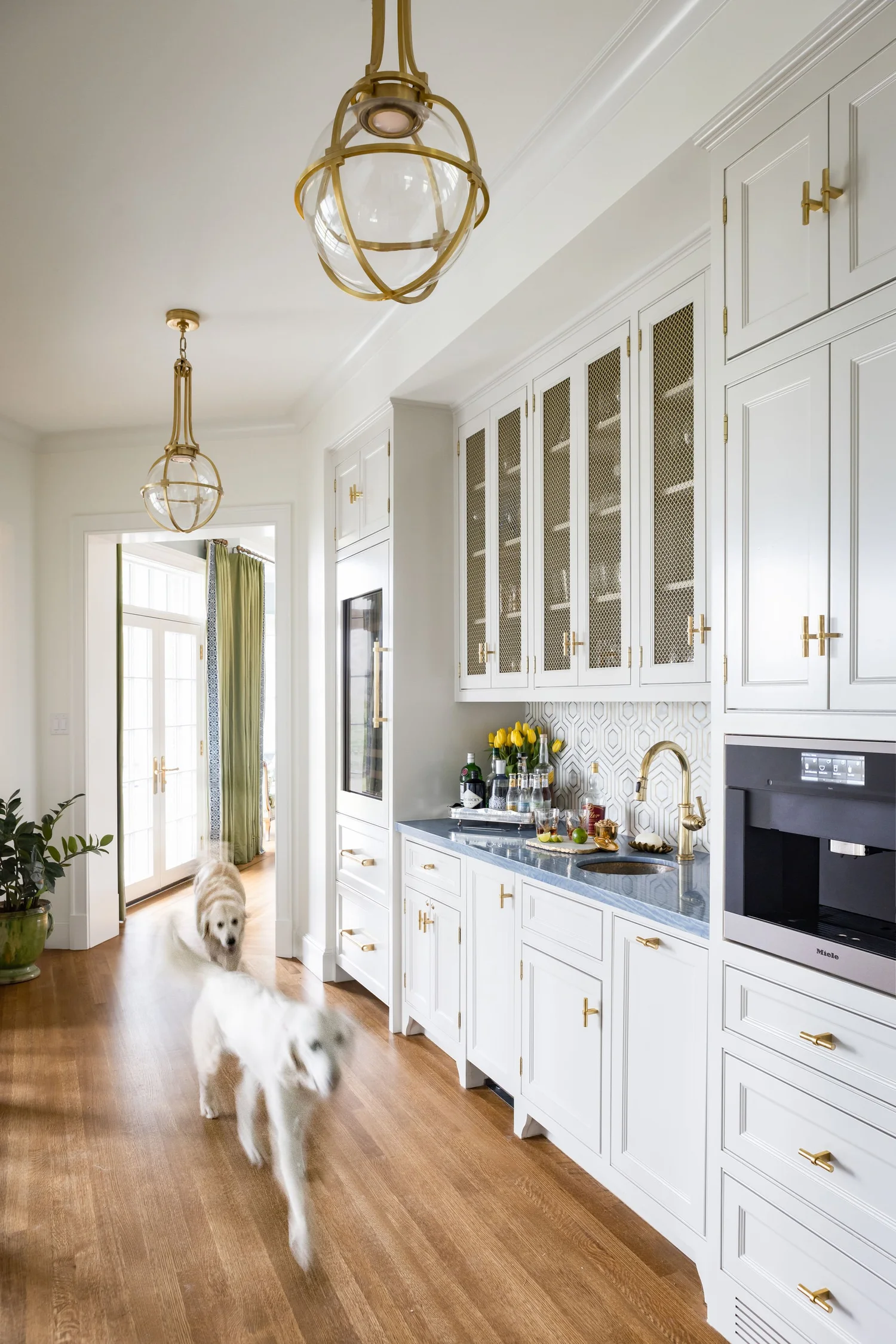 Love the wet bar in this home with a silver gallery tray that creates a bar for a timeless home design