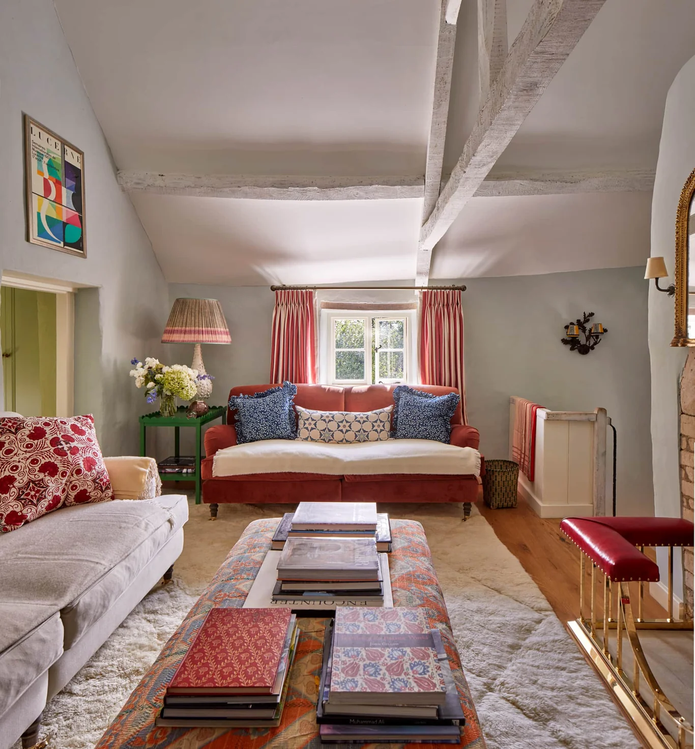 Charming lving room with patterned fabrics and abstract art