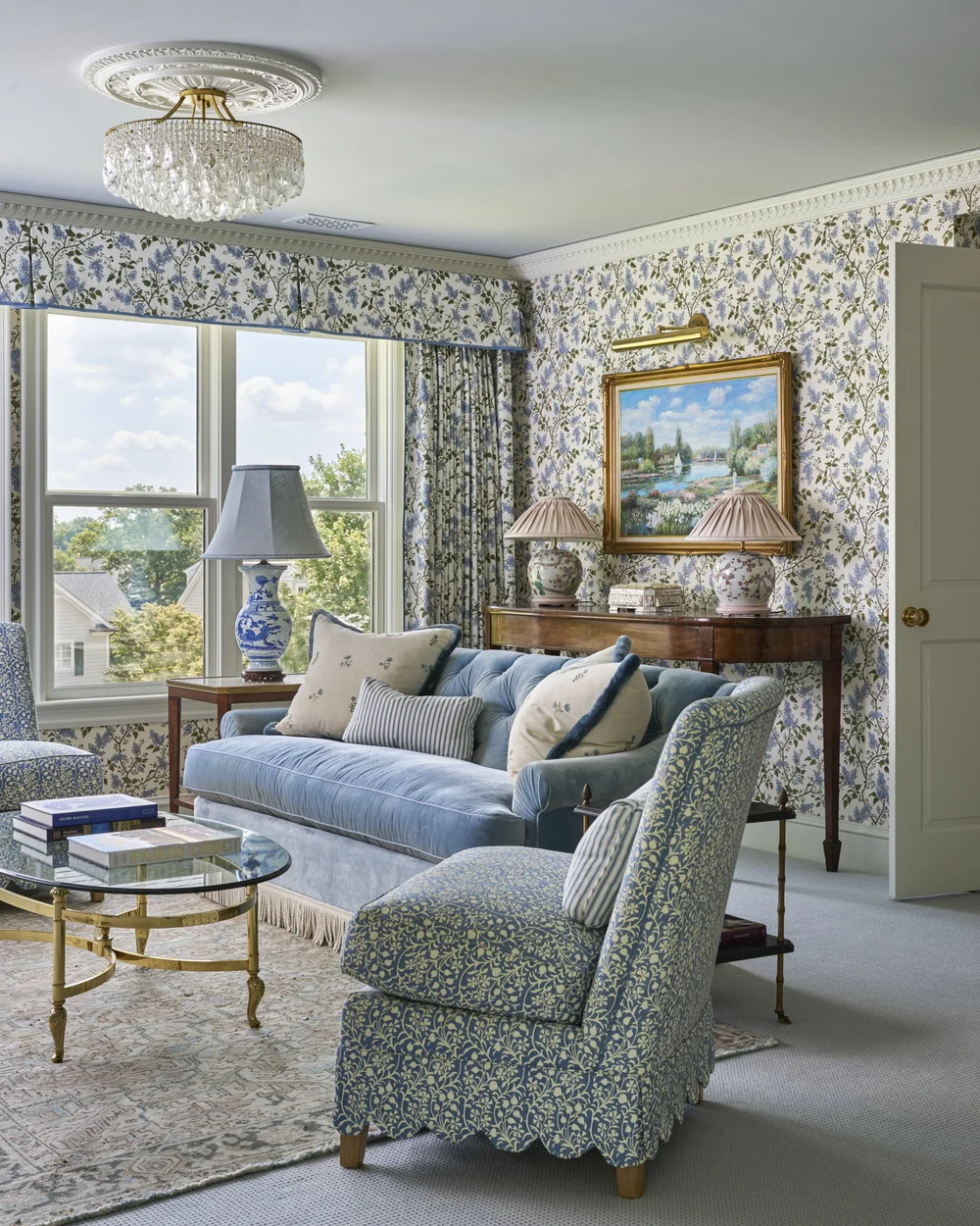 We are so excited to see this gorgeous blue and white primary bedroom sitting room designed by Jenkins Interiors and photographed by K8 Creative.