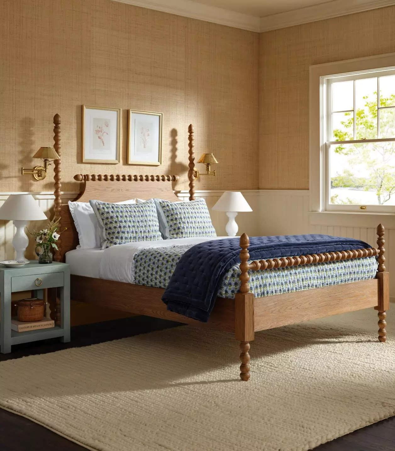 beautiful bedroom with grasscloth and blue nightstands
