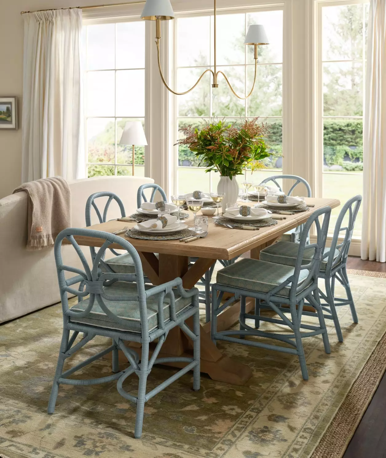 Love the blue wicker chair in this dining room