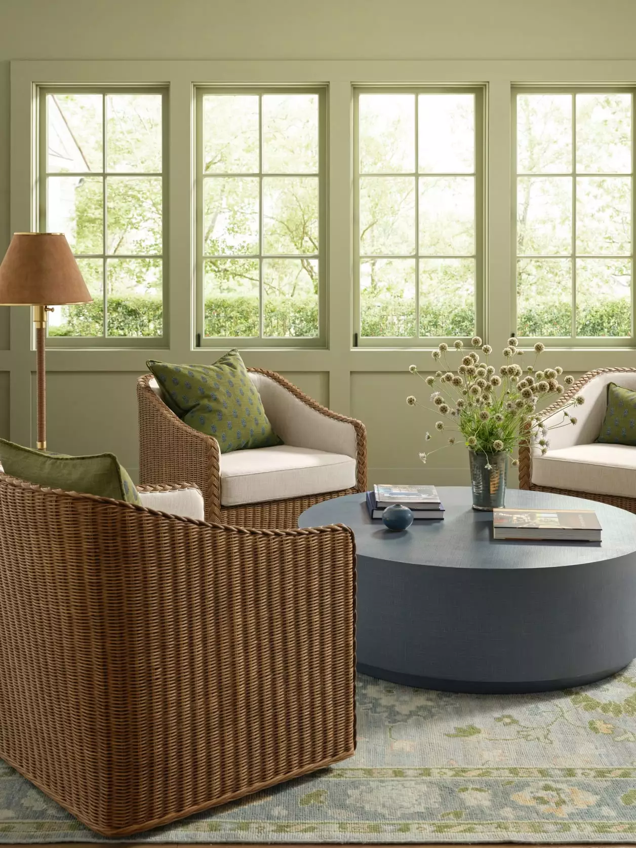 Love the room with 4 wicker chairs and green walls
