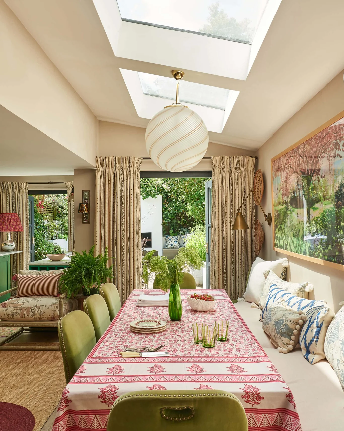Vanrenen Hanbury Interior Design | Mike Garlick Photography - love the banquette in this dining room with pink and white tablecloth