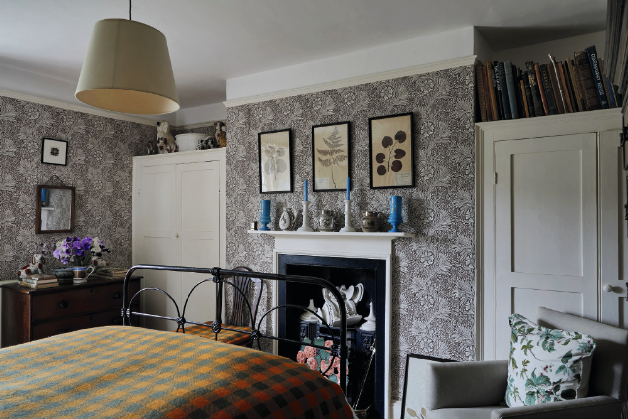 A Year at the Parsonage is an ode to the 15 years that award winning architect and interior designer Ben Pentreath and celebrated gardener Charlie McCormick made their home. This love letter to the Parsonage "walks readers through the history of the Parsonage; its rooms and the couple’s slow, incremental improvements to the property; and Charlie’s work envisioning and expanding the home’s humble garden into something magnificent and memorable." Love the bedroom with the check bedspread and English pattern wallpaper