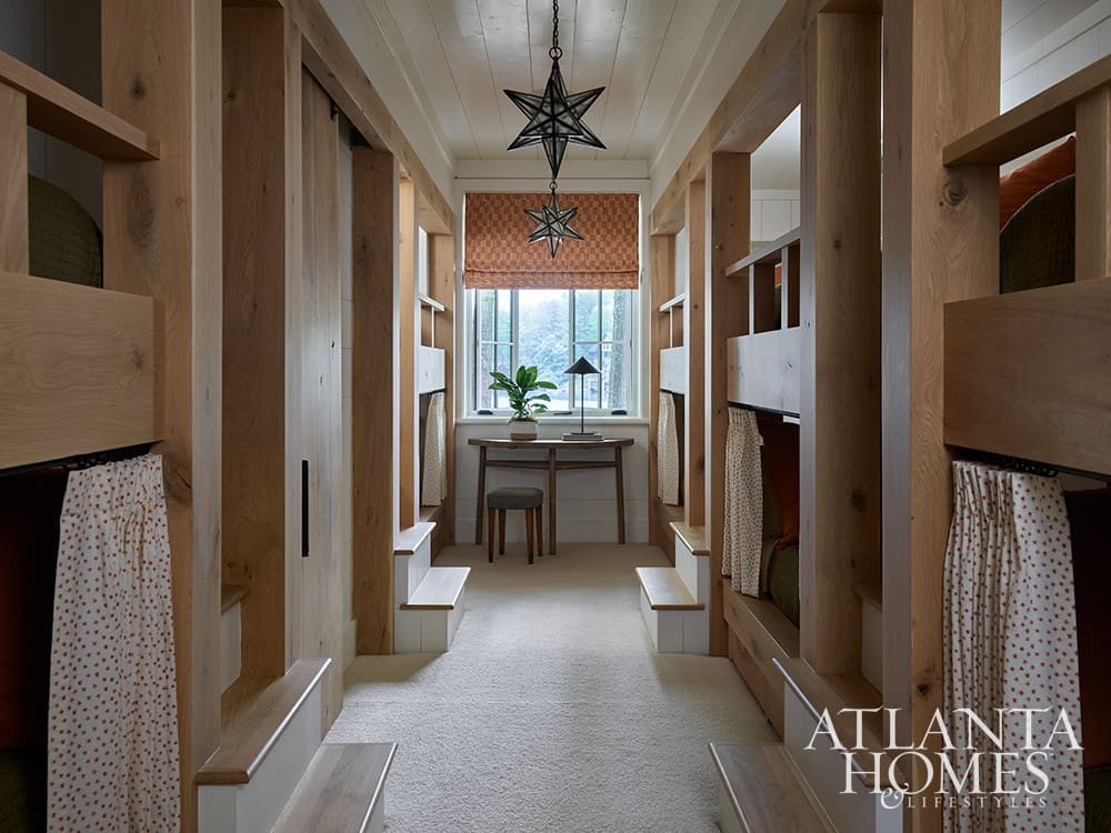 Classic built-in wooden bunk room design full of personality in a luxury lakeside retre