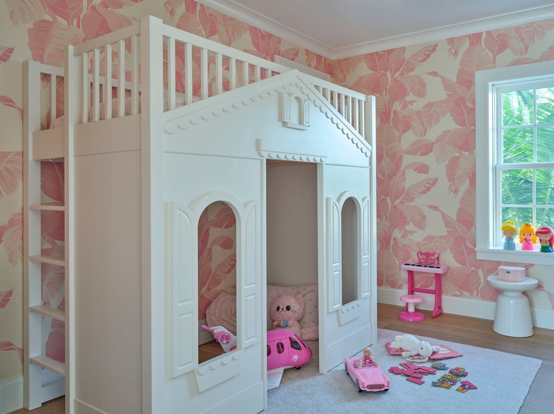 Girl's bedroom with built-in princess bed and pink and white wallpaper - Caitlin Kah Interior Design | Brantley Photography