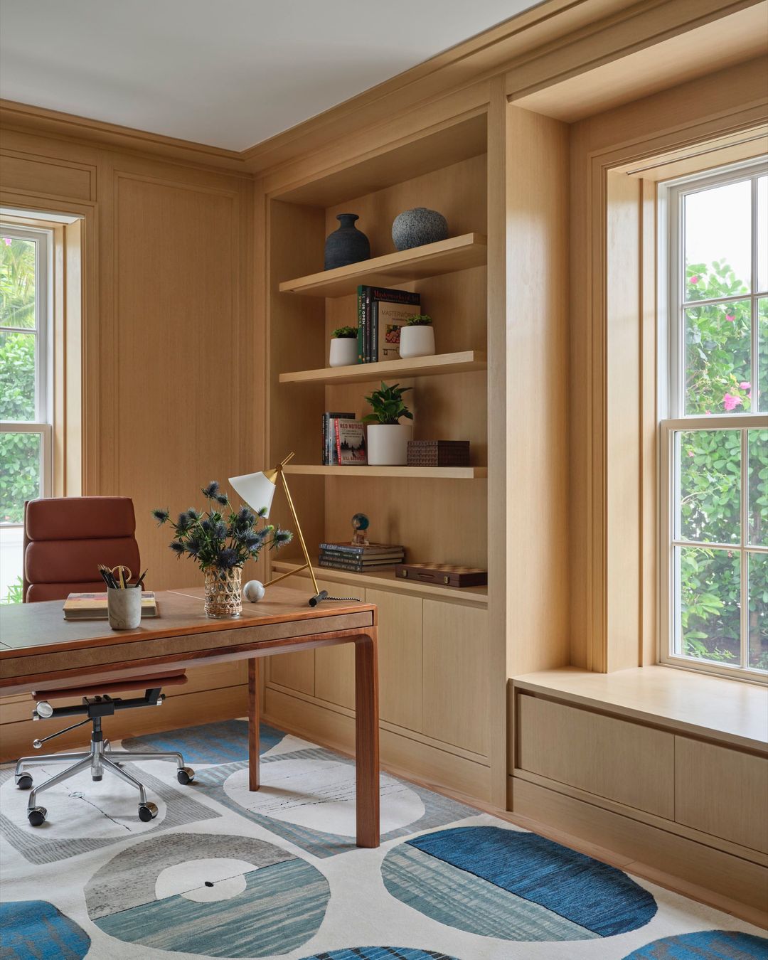 Palm Beach home with warm wood paneling in home office - Caitlin Kah Interior Design | Brantley Photography