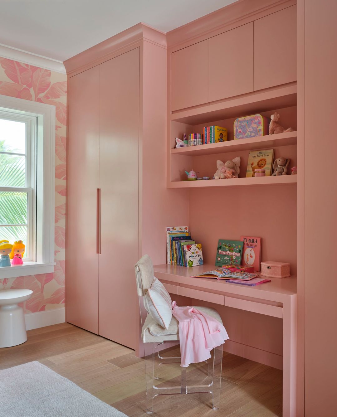 Girl's bedroom with built-in desk and closet and pink and white wallpaper - Caitlin Kah Interior Design | Brantley Photography