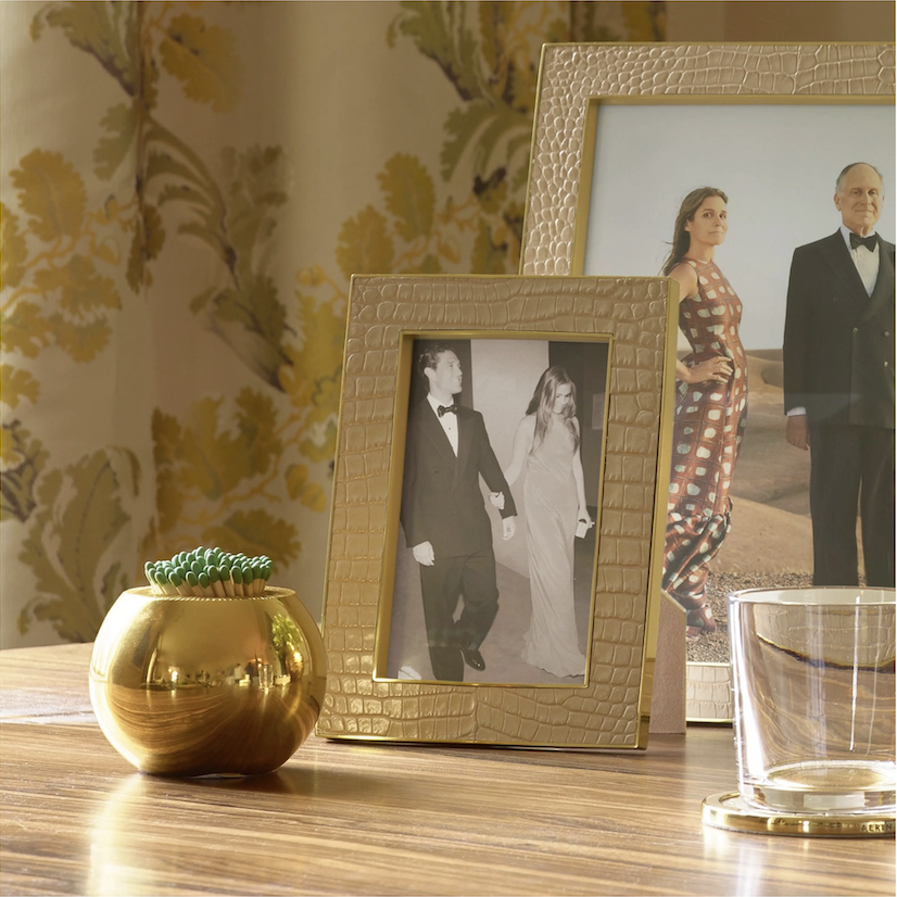 Aerin Brass Match Holder displayed as a luxury living room accessory on a styled coffee table tray vignette.