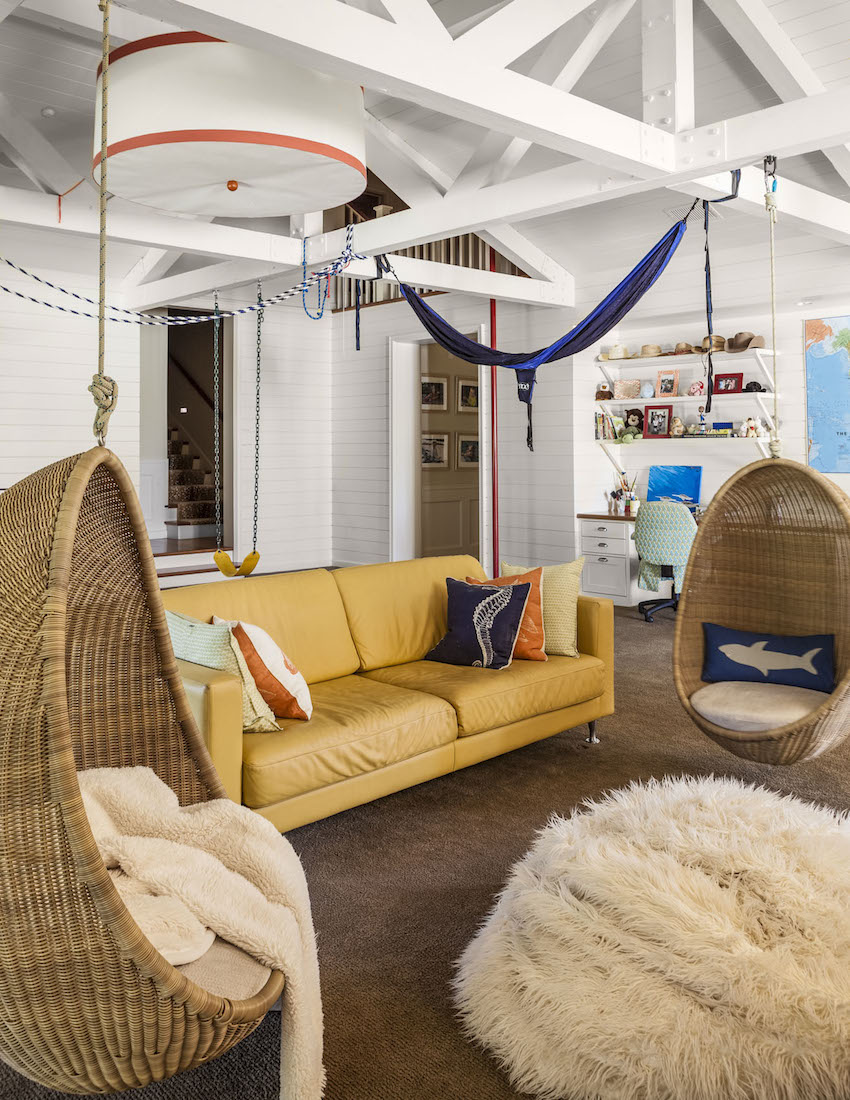 Collins Interiors | Nathan Schroder Photography - playroom with wicker hanging chairs