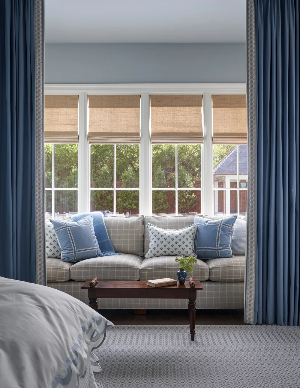 Jenkins Interiors | Nathan Schroder Photography - sofa in bedroom with curtains surrounding - cozy reading nook